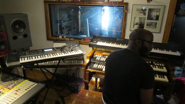 Organist at the Hammond and keyboards by the control room window